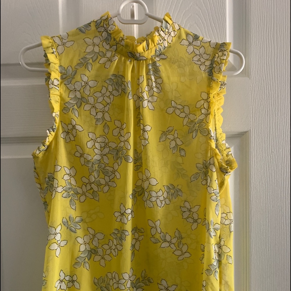 Yellow blouse with ruffled neckline
